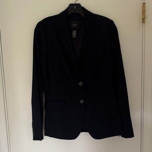 Navy blue pinstriped suit